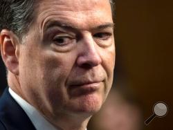 FILE - In this June 8, 2017, file photo, former FBI director James Comey testifies before the Senate Select Committee on Intelligence, on Capitol Hill in Washington. Comey blasts President Donald Trump as unethical and “untethered to truth” and his leadership of the country as “transactional, ego driven and about personal loyalty.” Comey’s comments come in a new book in which he casts Trump as a mafia boss-like figure who sought to blur the line between law enforcement and politics and tried to pressure him