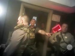 This photo from police officer video body camera footage on Oct. 1, 2017, provided by the Las Vegas Metropolitan Police Department, shows officers as they breach the shooter's room during the deadliest mass shooting in modern U.S. history by Stephen Paddock, at the Mandalay Bay Hotel in Las Vegas, released Wednesday, May 2, 2018. (Las Vegas Metropolitan Police Department via AP)