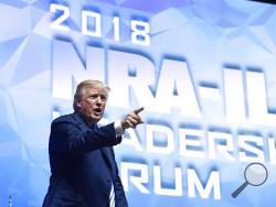President Donald Trump speaks at the National Rifle Association annual convention in Dallas, Friday, May 4, 2018. (AP Photo/Susan Walsh)