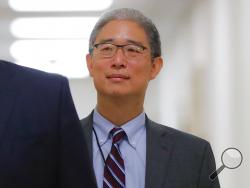 In this Aug. 28, 2018, file photo, Justice Department official Bruce Ohr arrives for a closed hearing of the House Judiciary and House Oversight committees on Capitol Hill in Washington. A former British spy told Ohr, a senior Justice Department lawyer, at a breakfast meeting on July 30, 2016, that Russian intelligence believed it had Donald Trump “over a barrel,” according to multiple people familiar with the encounter. (AP Photo/Pablo Martinez Monsivais)
