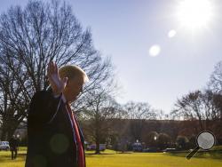 President Donald Trump waves as he departs after speaking on the South Lawn of the White House as he walks to Marine One, Sunday, Jan. 6, 2019, in Washington. Trump is en route to Camp David. (AP Photo/Alex Brandon)