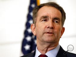 FILE - In this Feb. 2, 2019 file photo, Virginia Gov. Ralph Northam speaks during a news conference in the Governor's Mansion in Richmond, Va. Northam clung to his office Tuesday, Feb. 5, amid intense political fallout over a racist photo in his 1984 medical school yearbook and uncertainty about the future of the state's government. (AP Photo/Steve Helber, File)