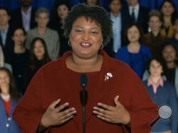 In this pool image from video, Stacey Abrams delivers the Democratic party's response to President Donald Trump's State of the Union address, Tuesday, Feb. 5, 2019 from Atlanta. Abrams narrowly lost her bid in November to become America's first black female governor, and party leaders are aggressively recruiting her to run for U.S. Senate from Georgia. Speaking from Atlanta, Abrams calls the shutdown a political stunt that "defied every tenet of fairness and abandoned not just our people, but our values." (