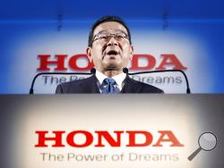 Honda's President and CEO Takahiro Hachigo speaks during a press conference in Tokyo Tuesday, Feb. 19, 2019. Honda Motor Co. plans to close its car factory in western England in 2021, the company said Tuesday, in a fresh blow to the British economy as it faces its March 29 exit from the European Union. (Yuya Shino/Kyodo News via AP)