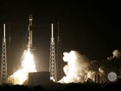 A SpaceX Falcon 9 rocket lifts off with Israel's Lunar Lander and an Indonesian communications satellite at space launch complex 40, Thursday, Feb. 21, 2019, in Cape Canaveral, Fla. An Israeli spacecraft blasted off to the moon in an attempt to make the country’s first lunar landing, following a launch Thursday night by SpaceX. (AP Photo/Terry Renna)