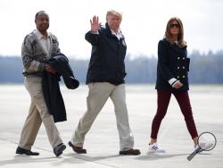 President Donald Trump, first lady Melania Trump and Secretary of Housing and Urban Development Ben Carson walk from Marine One to board Air Force One at Lawson Army Airfield, Fort Benning, Ga., Friday, March 8, 2019, en route Palm Beach International Airport in West Palm Beach, Fla., after visiting Lee County, Ala., where tornados killed 23 people. (AP Photo/Carolyn Kaster)