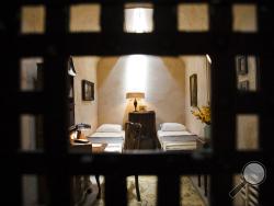 This Thursday, May 2, 2019 photo, shows a recreation of mobster Al Capone's 1929 cell at the Eastern State Penitentiary, which is now a museum in Philadelphia. (AP Photo/Matt Rourke)