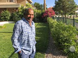 This photo provided by Didier J. Fabien shows O.J. Simpson in the garden of his Las Vegas area home on Monday, June 3, 2019. After 25 years living under the shadow of one of the nation s most notorious murder cases, Simpson says his life now is fine. (Didier J. Fabien via AP)