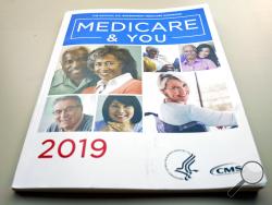 FILE - In this Nov. 8, 2018, file photo, the U.S. Medicare Handbook is photographed, in Washington. Medicare could save $1.57 for every dollar spent delivering free meals to frail seniors in the first week after they come home following a hospitalization, says a new study that comes as lawmakers express interest in practical services that can improve patients’ well-being. (AP Photo/Pablo Martinez Monsivais, File)