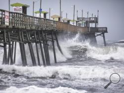 Waves pound the Bogue Inlet Fishing Pier in Emerald Isle, N.C.,as Hurricane Dorian moves north off the coast. (Julia Wall/The News & Observer via AP)