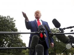 President Donald Trump speaks to members of the media on the South Lawn of the White House in Washington, Thursday, Oct. 3, 2019, before boarding Marine One for a short trip to Andrews Air Force Base, Md., and then on to Florida. (AP Photo/Andrew Harnik)