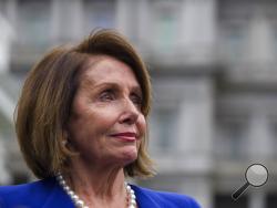 House Speaker Nancy Pelosi of Calif., listens while speaking with reporters after a meeting with President Donald Trump at the White House, Wednesday, Oct. 16, 2019, in Washington. (AP Photo/Alex Brandon)
