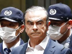 FILE - In this April 25, 2019, file photo, former Nissan Chairman Carlos Ghosn leaves Tokyo's Detention Center for bail in Tokyo. By jumping bail, Ghosn, who had long insisted on his innocence, has now committed a clear crime and can never return to Japan without going to jail. (Kyodo News via AP, File)