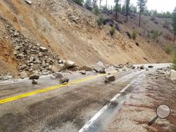 This photo provided by Tyler Beyer shows a rockslide on Highway 21 near Lowman, Idaho, after a magnitude 6.5 earthquake struck Tuesday, March 31, 2020. The earthquake struck north of Boise, Idaho, Tuesday evening, with people across a large area reporting shaking. (Tyler Beyer via AP)
