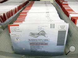 FILE - In this Nov. 1, 2016, file photo, mail-in ballots for the 2016 General Election are shown at the elections ballot center at the Salt Lake County Government Center, in Salt Lake City. As President Donald Trump rails against voting by mail, many members of his own political party are embracing it to keep their voters safe during the coronavirus outbreak. (AP Photo/Rick Bowmer, File)
