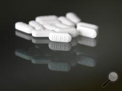 FILE - This Monday, April 6, 2020 file photo shows an arrangement of hydroxychloroquine pills in Las Vegas. According to a study released on Tuesday, April 21, 2020, the malaria drug widely touted by President Donald Trump for treating the new coronavirus showed no benefit in an analysis of its use in U.S. veterans hospitals. There were more deaths among those given hydroxychloroquine versus standard care, researchers report. (AP Photo/John Locher)