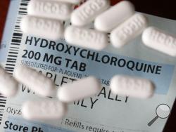 FILE - This Monday, April 6, 2020, file photo shows an arrangement of Hydroxychloroquine pills in Las Vegas. At least 13 states have obtained a total of more than 10 million doses of malaria drugs to treat COVID-19 patients despite warnings from doctors that more tests are needed before the medications that President Trump once fiercely promoted should be used to help people with the coronavirus. (AP Photo/John Locher,File)