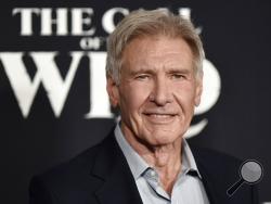 FILE - In this Feb. 13, 2020 file photo, Harrison Ford attends the premiere of "The Call of the Wild" in Los Angeles. Ford was piloting a plane that wrongly crossed a runway where another plane was landing, and federal authorities are investigating, officials and a representative for the actor said Wednesday. (Photo by Richard Shotwell/Invision/AP)