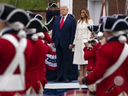 President Donald Trump and first lady Melania Trump participate in a Memorial Day ceremony at Fort McHenry National Monument and Historic Shrine, Monday, May 25, 2020, in Baltimore. (AP Photo/Evan Vucci)