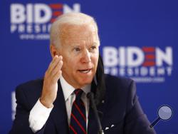 In this June 11, 2020, photo, Democratic presidential candidate former Vice President Joe Biden speaks during a roundtable on economic reopening with community members in Philadelphia. Biden’s search for a running mate is entering a second round of vetting for a dwindling list of potential vice presidential nominees, with several black women in strong contention. (AP Photo/Matt Slocum)