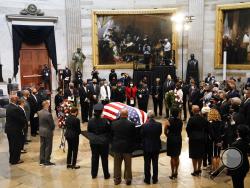 Members of the Congressional Black Caucus, say farewell at the conclusion of a service for the late Rep. John Lewis, D-Ga., a key figure in the civil rights movement and a 17-term congressman from Georgia, as he lies in state at the Capitol in Washington, Monday, July 27, 2020. (AP Photo/J. Scott Applewhite, Pool)