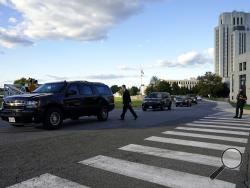 A police officer blocks a road before President Donald Trump arrives at Walter Reed National Military Medical Center, in Bethesda, Md., Friday, Oct. 2, 2020, after he tested positive for COVID-19. (AP Photo/Jacquelyn Martin)