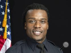 This undated photo provided by the Wauwatosa Police Department in Wauwatosa, Wis., shows Wauwatosa Police Officer Joseph Mensah. In a report released Wednesday Oct. 7, 2020, an independent investigator recommended officials in the Milwaukee suburb fire Mensah, who has shot and killed three people in the last five years. (Gary Monreal/Monreal Photography LLC/Wauwatosa Police Department via AP)