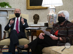President Joe Biden meets with Treasury Secretary Janet Yellen in the Oval Office of the White House, Friday, Jan. 29, 2021, in Washington. (AP Photo/Evan Vucci)