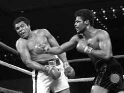 FILE - In this Feb. 15, 1978, file photo, Leon Spinks, right, connects with a right hook to Muhammad Ali, during the late rounds of their championship fight in Las Vegas. Former heavyweight champion Leon Spinks Jr. died Friday night, Feb. 5, 2021, after battling prostate and other cancers. He was 67. (AP Photo/File)