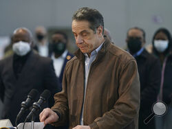 New York Gov. Andrew Cuomo speaks at a vaccination site on Monday, March 8, 2021, in New York. A lawyer for Gov. Andrew Cuomo said Thursday that she reported a groping allegation made against him to local police after the woman involved declined to press charges herself. (AP Photo/Seth Wenig, Pool)