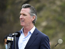 FILE - In this April 23, 2021, file photo, California Gov. Gavin Newsom speaks during a press conference about the newly reopened Highway 1 at Rat Creek near Big Sur, Calif. Organizers of the recall effort against Gov. Newsom collected enough valid signatures to qualify for the ballot. The California secretary of state’s office announced Monday, April 26, 2021 that more than 1.6 million signatures had been verified, about 100,000 more than needed to force a vote on the first-term Democrat. (AP Photo/Nic Cou