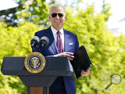 President Joe Biden responds to a question from reporters about COVID-19, on the North Lawn of the White House, Tuesday, April 27, 2021, in Washington. (AP Photo/Evan Vucci)
