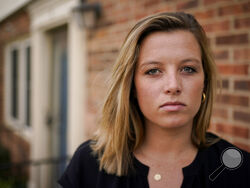 Shannon Keeler poses for a portrait in the United States on Wednesday, April 7, 2021. A series of online messages from a long-ago schoolmate has Keeler, a Gettysburg College graduate, trying again to get authorities to make an arrest in her 2013 sexual assault. (AP Photo)