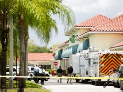 Police gather at the Publix shopping center at the scene of a shooting in Royal Palm Beach, Fla., on Thursday, June 10, 2021. Authorities say a shooting inside a Florida supermarket has left three people dead, including the shooter. (Greg Lovett /The Palm Beach Post via AP)