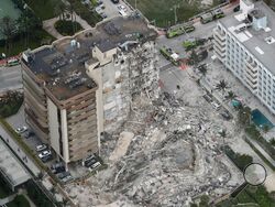 This aerial photo shows part of the 12-story oceanfront Champlain Towers South Condo that collapsed early Thursday, June 24, 2021 in Surfside, Fla. (Amy Beth Bennett /South Florida Sun-Sentinel via AP)