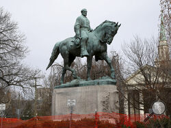 FILE - The statue of Robert E. Lee is seen uncovered in Emancipation Park in Charlottesville, Va., on Wednesday, Feb. 28, 2018. Charlottesville said in a news release Friday, July 9, 2021, that the equestrian statue of Confederate Gen. Robert E. Lee as well as a nearby one of Confederate Gen. Thomas “Stonewall” Jackson will be taken down Saturday. (Zack Wajsgras/The Daily Progress via AP)