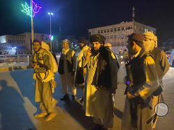 Taliban fighters take control of Afghan presidential palace after the Afghan President Ashraf Ghani fled the country, in Kabul, Afghanistan, Sunday, Aug. 15, 2021. (AP Photo/Zabi Karimi)