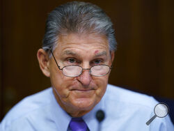 FILE - In this Aug. 5, 2021, file photo Sen. Joe Manchin, D-W.Va., prepares to chair a hearing in the Senate Energy and Natural Resources Committee, as lawmakers work to advance the $1 trillion bipartisan bill, at the Capitol in Washington. Manchin said Thursday, Sept. 2, that Congress should take a “strategic pause” on more spending, warning that he does not support President Joe Biden's plans for a sweeping $3.5 trillion effort to rebuild and reshape the economy. (AP Photo/J. Scott Applewhite, File)