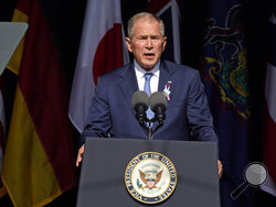 Former President George W. Bush speaks at the Flight 93 National Memorial in Shanksville, Pa., Saturday, Sept. 11, 2021, on the 20th anniversary of the Sept. 11, 2001 attacks. (AP Photo/Gene J. Puskar)