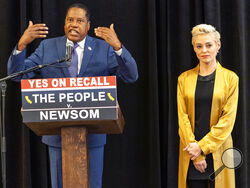 Republican conservative radio talk show host Larry Elder with former actress and activist Rose McGowan hold a news conference at the Luxe Hotel Sunset Boulevard in Los Angeles Sunday, Sept. 12, 2021. Elder is running to replace Democratic Gov. Gavin Newsom in the Sept. 14 recall election. McGowan, who is known for her role in the "Scream" movie franchise, was one of the earliest of dozens of women to accuse Hollywood producer Harvey Weinstein of sexual misconduct, making her a major figure in the #MeToo mov