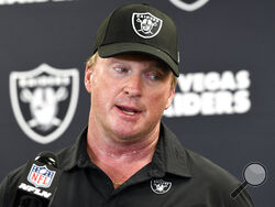 FILE - Las Vegas Raiders head coach Jon Gruden speaks with the media following an NFL football game against the Pittsburgh Steelers in Pittsburgh on Sept. 19, 2021. The former Raiders coach has sued commissioner Roger Goodell and the NFL, alleging that a “malicious and orchestrated campaign” was used to destroy his career by leaking old offensive emails from him. The suit was filed in district court in Clark County, Nev., on Thursday, Nov. 11, 2021, exactly a month after Gruden resigned as Raiders coach fol