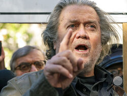 Former White House strategist Steve Bannon pauses to speak with reporters after departing federal court, Monday, Nov. 15, 2021, in Washington. (AP Photo/Alex Brandon)