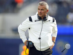 FILE - Jacksonville Jaguars head coach Urban Meyer stands on the field before an NFL football game against the Los Angeles Rams Sunday, Dec. 5, 2021, in Inglewood, Calif. Urban Meyer's tumultuous NFL tenure ended after just 13 games — and two victories — when the Jacksonville Jaguars fired him early Thursday, Dec. 16, 2021 because of an accumulation of missteps. (AP Photo/Jae C. Hong , File)