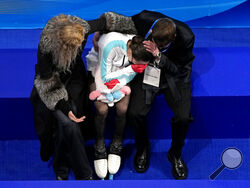 Kamila Valieva, of the Russian Olympic Committee, reacts after competing in the women's free skate program during the figure skating competition at the 2022 Winter Olympics, Thursday, Feb. 17, 2022, in Beijing. (AP Photo/Jeff Roberson)