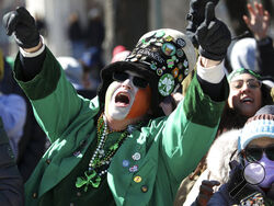 A parade goer yells during the St. Patrick's Day Parade along South Columbus Drive, Saturday, March 12, 2022, in Chicago. (John J. Kim/Chicago Tribune via AP)