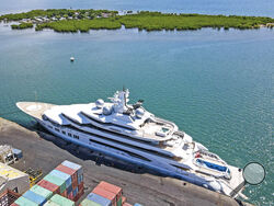 FILE - The superyacht Amadea is docked at the Queens Wharf in Lautoka, Fiji, on April 15 2022. The superyacht that American authorities say is owned by a Russian oligarch previously sanctioned for alleged money laundering has been seized by law enforcement in Fiji, the U.S. Justice Department announced Thursday, May 5. (Leon Lord/Fiji Sun via AP, File)