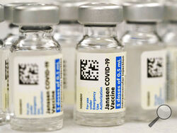 FILE - Vials of the Johnson & Johnson COVID-19 vaccine are seen at a pharmacy in Denver on Saturday, March 6, 2021. On Thursday, May 5, 2022, U.S. regulators strictly limited who can receive this vaccine due to a rare but serious risk of blood clots. (AP Photo/David Zalubowski, File)