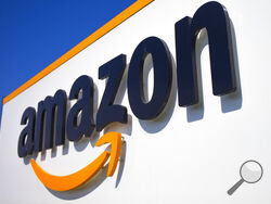 FILE - The Amazon logo is seen in Douai, northern France, April 16, 2020. In August 2022, Amazon has said it will spend billions of dollars in two gigantic acquisitions that, if approved, will broaden its ever growing presence in the lives of consumers. This time, the company is targeting two areas: health care and the "smart home." (AP Photo/Michel Spingler, File)