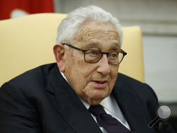 FILE - Former Secretary of State Henry Kissinger speaks during a meeting with President Donald Trump in the Oval Office of the White House, Oct. 10, 2017, in Washington. Kissinger, the diplomat with the thick glasses and gravelly voice who dominated foreign policy as the United States extricated itself from Vietnam and broke down barriers with China, died Wednesday, Nov. 29, 2023. He was 100. (AP Photo/Evan Vucci, File)