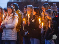 FILE - Boise State University students, along with people who knew the four University of Idaho students who were found killed in Moscow, Idaho, days earlier, pay their respects at a vigil held in front of a statue on the Boise State campus, Thursday, Nov. 17, 2022, in Boise, Idaho. The arrest of Bryan Christopher Kohberger in the Nov. 13, 2022 fatal stabbings of four University of Idaho students has brought relief to the small college town of Moscow, Idaho.(Sarah A. Miller/Idaho Statesman via AP, File)